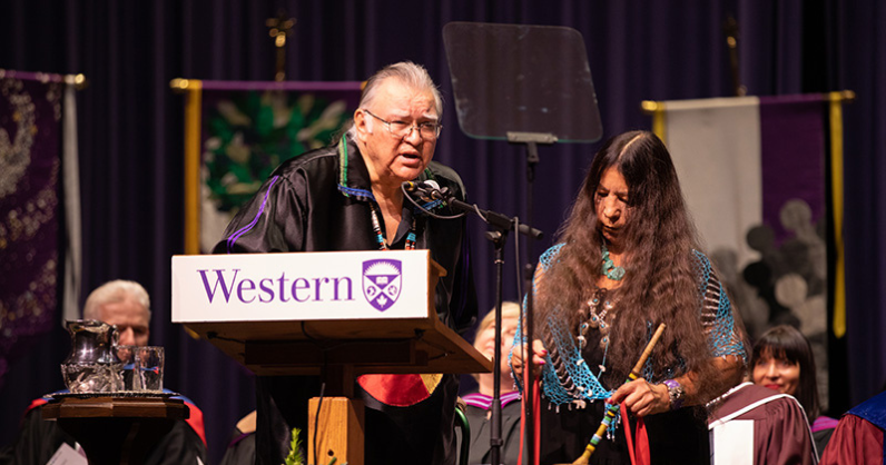 Dan Smoke on stage with Mary Lou Smoke at Western Convocation
