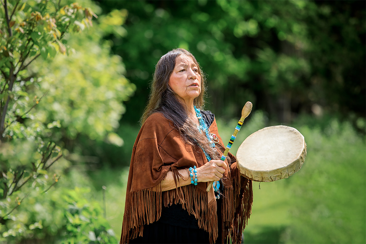 Marry Lou Smoke: playing a hand drum
