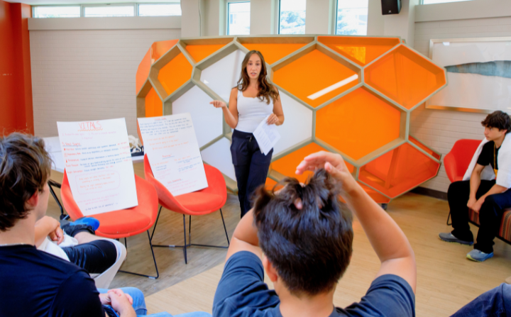 tutor speaking to indigenous youth